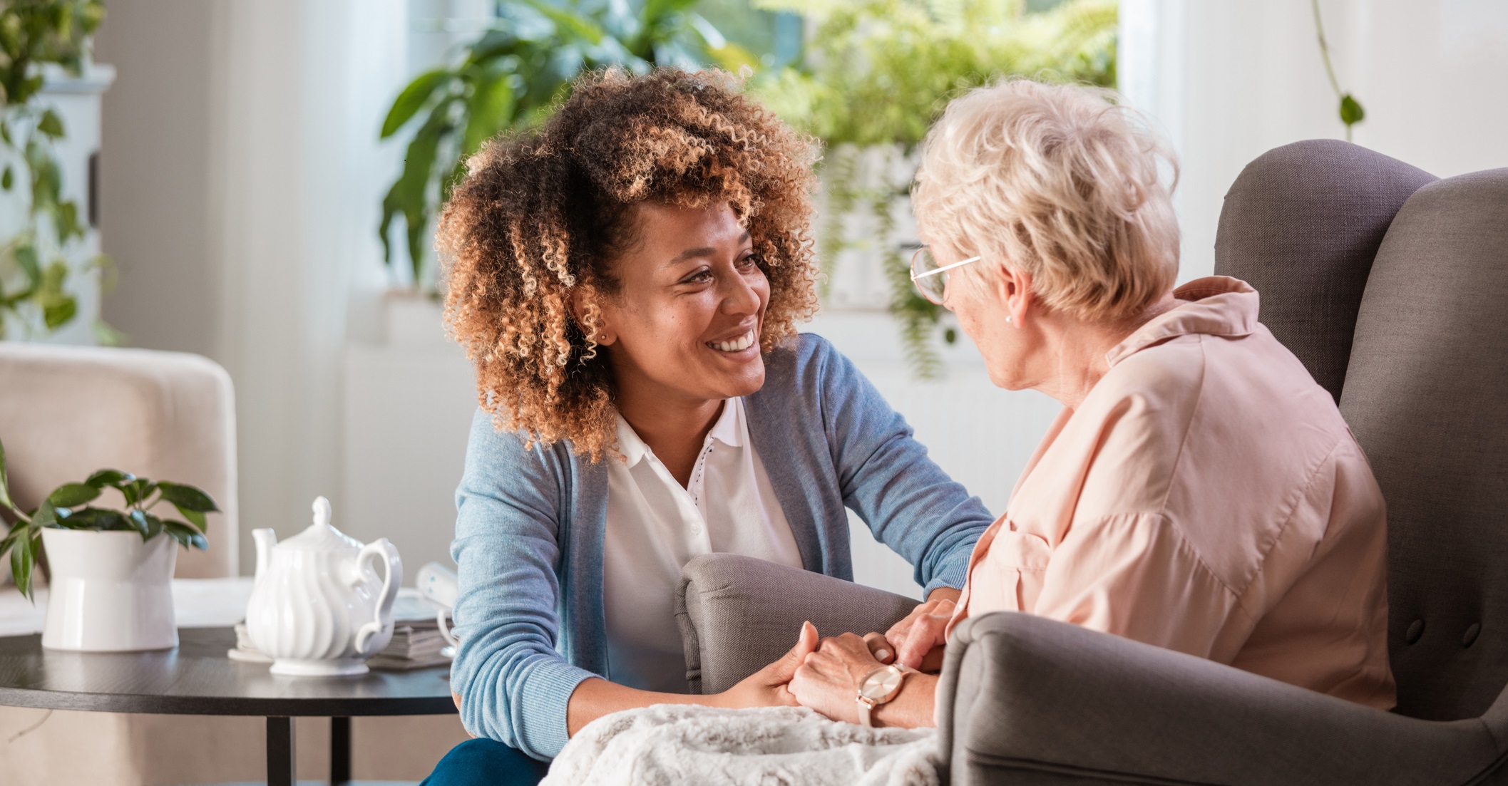Caregiver helping an elderly client with daily tasks